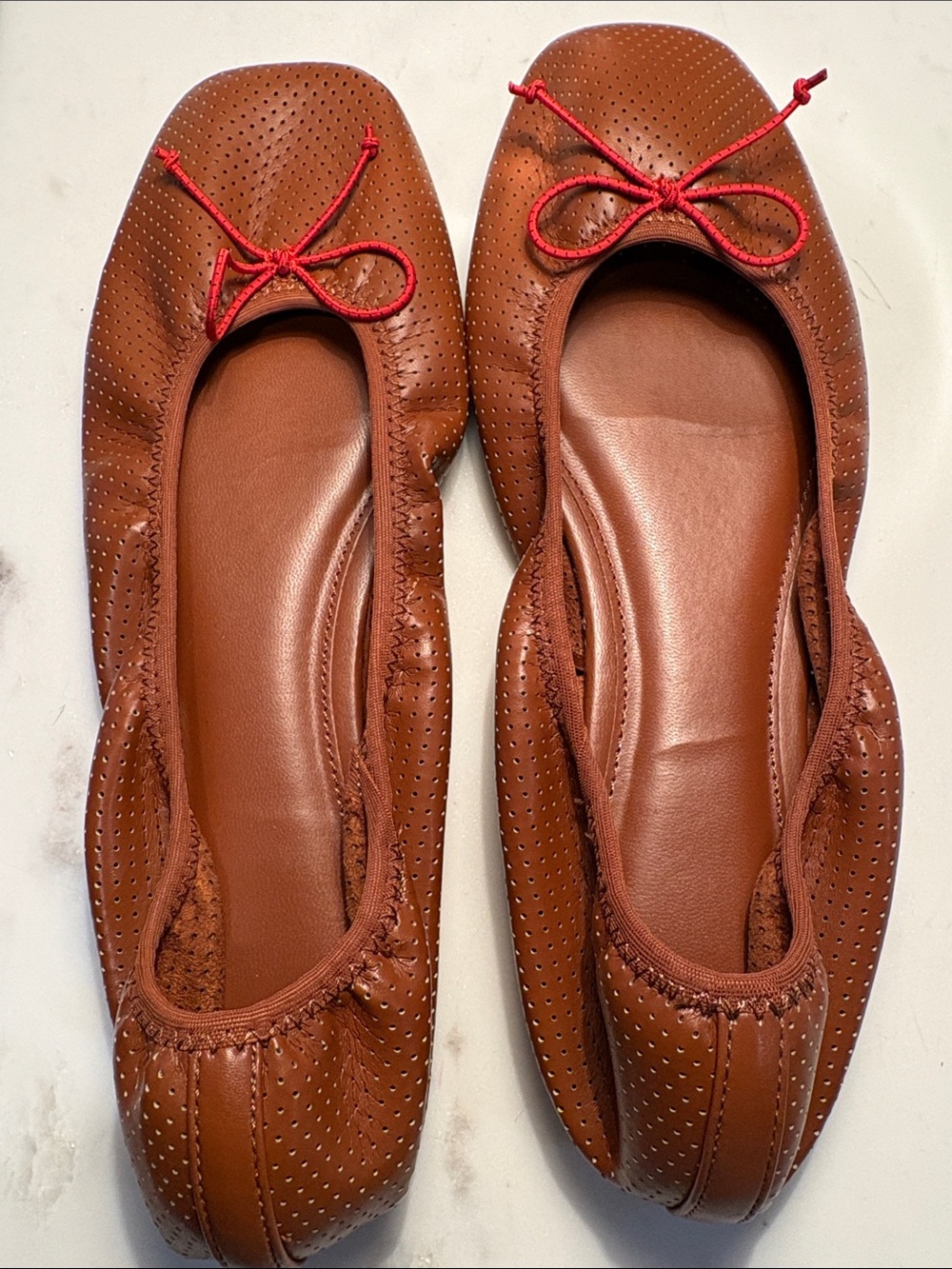 Mango Perforated Brown Ballet Flats with Red Cord Bow